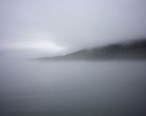 Preview wallpaper mountain, slope, fog, sea, nature