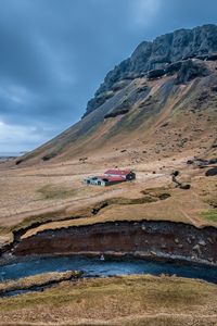 Preview wallpaper mountain, slope, house, river, nature