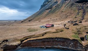 Preview wallpaper mountain, slope, house, river, nature