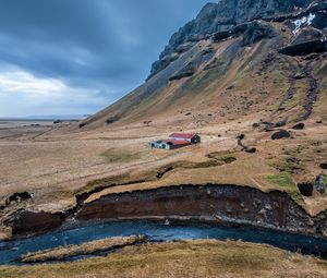 Preview wallpaper mountain, slope, house, river, nature