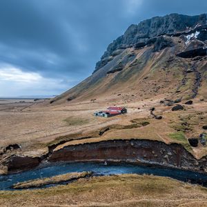 Preview wallpaper mountain, slope, house, river, nature