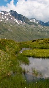 Preview wallpaper mountain, slope, pond, grass, nature