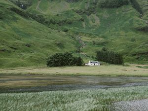 Preview wallpaper mountain, slope, river, house, grass