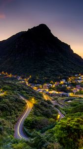 Preview wallpaper mountain, slope, road, houses, lights