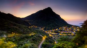 Preview wallpaper mountain, slope, road, houses, lights