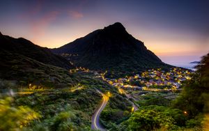 Preview wallpaper mountain, slope, road, houses, lights
