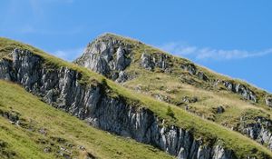 Preview wallpaper mountain, slope, rocks, grass, nature