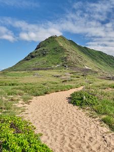 Preview wallpaper mountain, slope, sand, grass, trail, sky, clouds