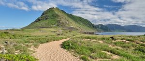 Preview wallpaper mountain, slope, sand, grass, trail, sky, clouds