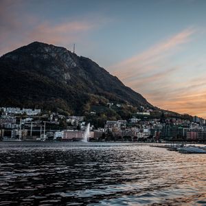 Preview wallpaper mountain, slope, sea, buildings