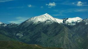 Preview wallpaper mountain, slope, snow, grass