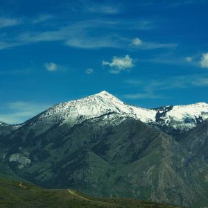 Preview wallpaper mountain, slope, snow, grass
