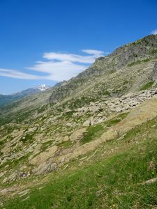 Preview wallpaper mountain, slope, stones, grass, nature, landscape