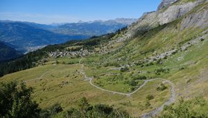 Preview wallpaper mountain, slope, valley, path, houses, landscape