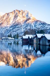 Preview wallpaper mountain, snow, lake, houses, reflection, landscape