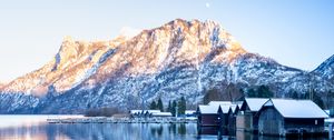 Preview wallpaper mountain, snow, lake, houses, reflection, landscape
