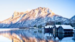 Preview wallpaper mountain, snow, lake, houses, reflection, landscape
