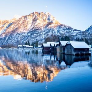 Preview wallpaper mountain, snow, lake, houses, reflection, landscape