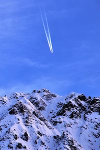 Preview wallpaper mountain, snow, plane, sky, snowy, flight, peak