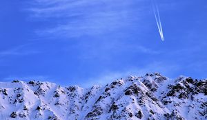 Preview wallpaper mountain, snow, plane, sky, snowy, flight, peak