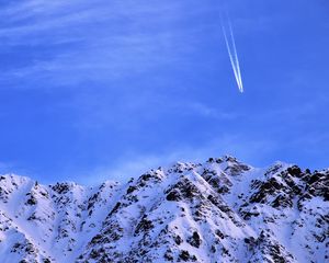 Preview wallpaper mountain, snow, plane, sky, snowy, flight, peak