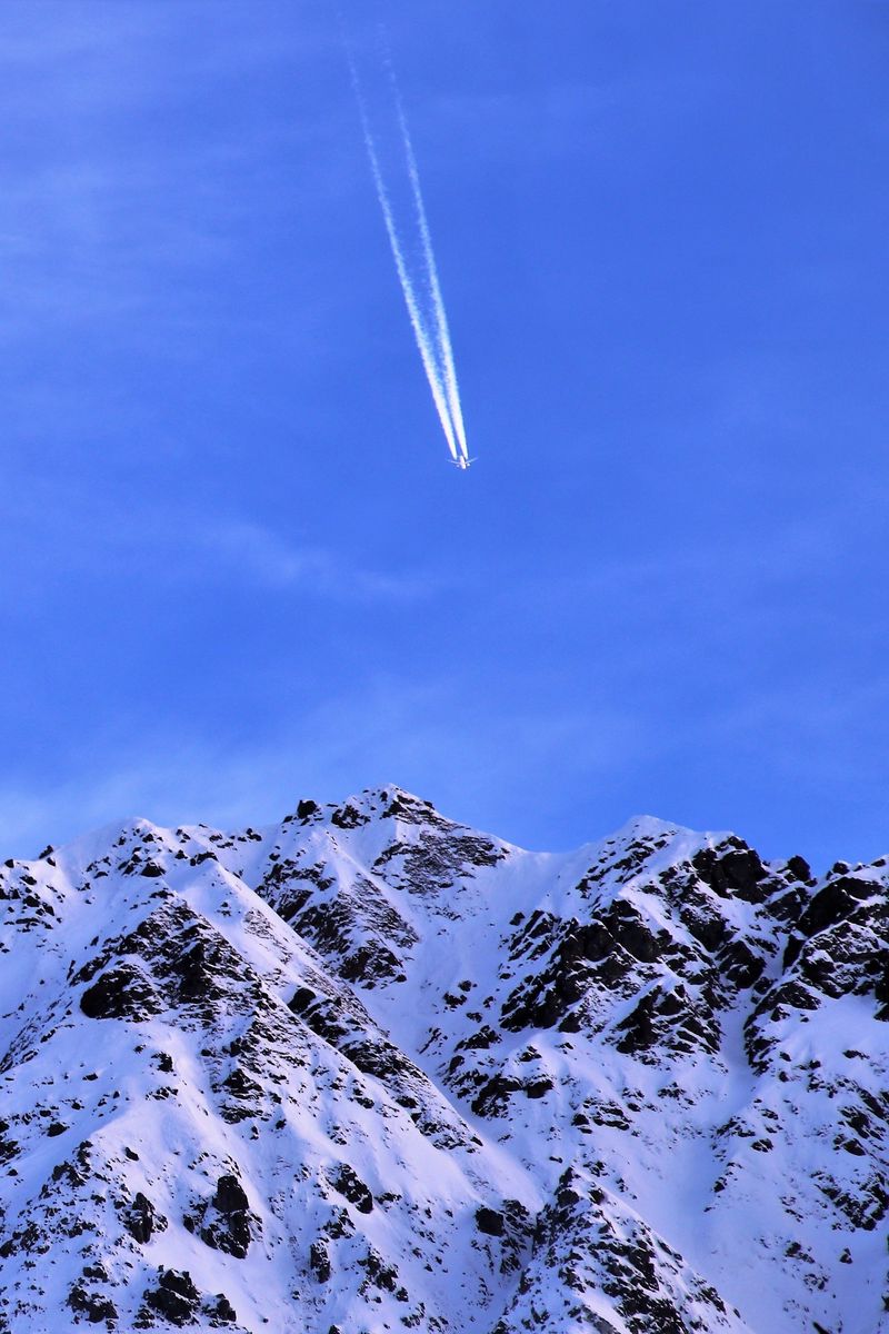 Download Wallpaper 800x1200 Mountain Snow Plane Sky Snowy Flight