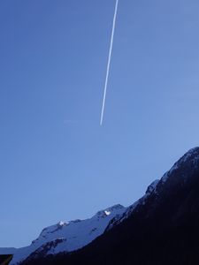 Preview wallpaper mountain, snow, plane, trail, nature