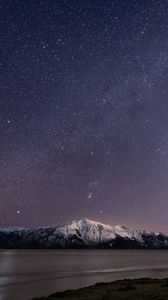 Preview wallpaper mountain, snow, sea, starry sky, night