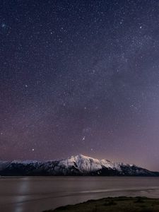 Preview wallpaper mountain, snow, sea, starry sky, night