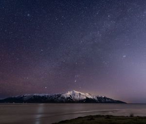 Preview wallpaper mountain, snow, sea, starry sky, night