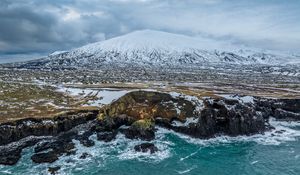 Preview wallpaper mountain, snow, slope, sea, shore