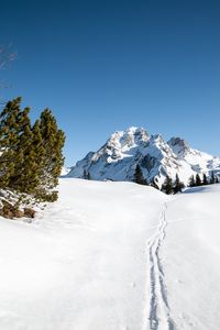 Preview wallpaper mountain, snow, traces, path, winter, landscape