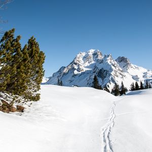 Preview wallpaper mountain, snow, traces, path, winter, landscape