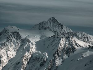 Preview wallpaper mountain, snowy, snow, winter, peaks, sky