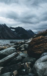 Preview wallpaper mountain, stones, water, lake, fog, overcast