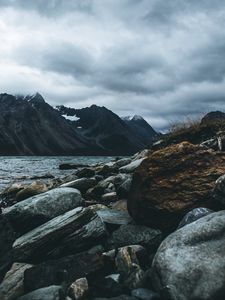 Preview wallpaper mountain, stones, water, lake, fog, overcast