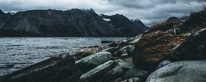 Preview wallpaper mountain, stones, water, lake, fog, overcast