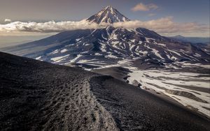 Preview wallpaper mountain, summit, clouds, kamchatka peninsula, russia