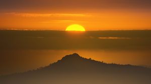 Preview wallpaper mountain, sun, clouds, dark, evening