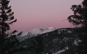 Preview wallpaper mountain, sunset, sky, trees, snowy, peak