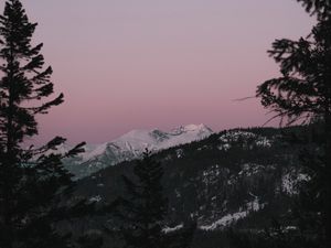 Preview wallpaper mountain, sunset, sky, trees, snowy, peak