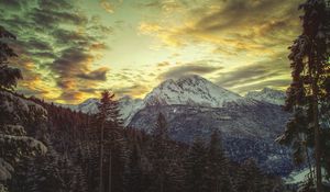 Preview wallpaper mountain, top, snow-covered, clouds, sky, pines, light, shadows, dullness, colors