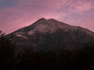 Preview wallpaper mountain, trees, dusk, sky, purple