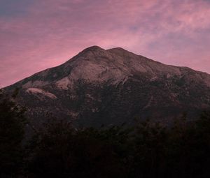 Preview wallpaper mountain, trees, dusk, sky, purple