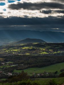 Preview wallpaper mountain, valley, clouds, overcast, village