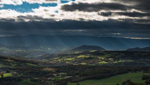 Preview wallpaper mountain, valley, clouds, overcast, village