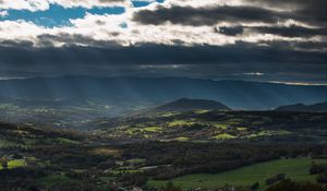 Preview wallpaper mountain, valley, clouds, overcast, village