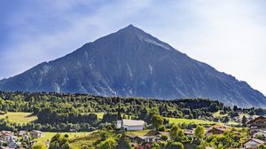 Preview wallpaper mountain, valley, trees, houses, nature