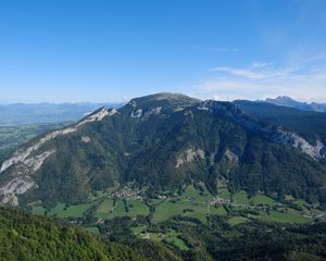 Preview wallpaper mountain, valley, trees, houses, nature, sky