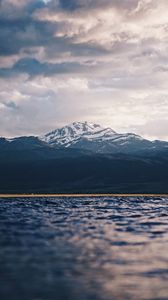 Preview wallpaper mountain, water, blur, peaks, clouds